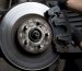 Closeup of car mechanic repairing brake pads